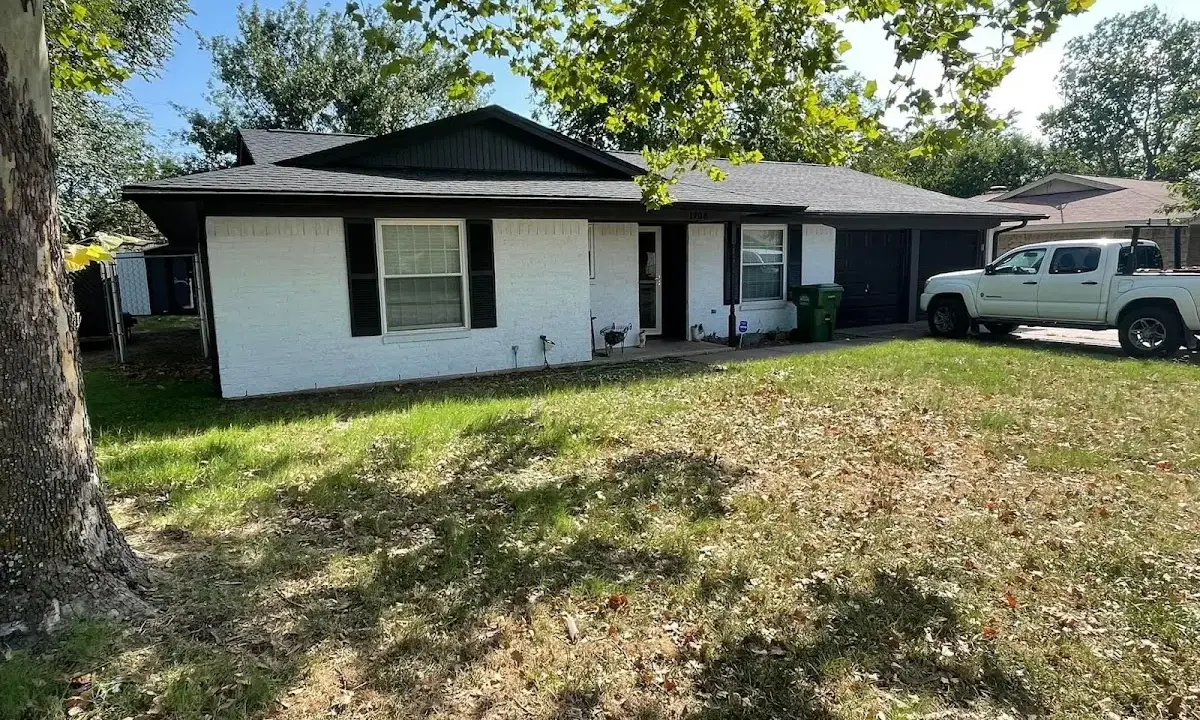 Professional roofing crew working on a residential roof in St. Peter